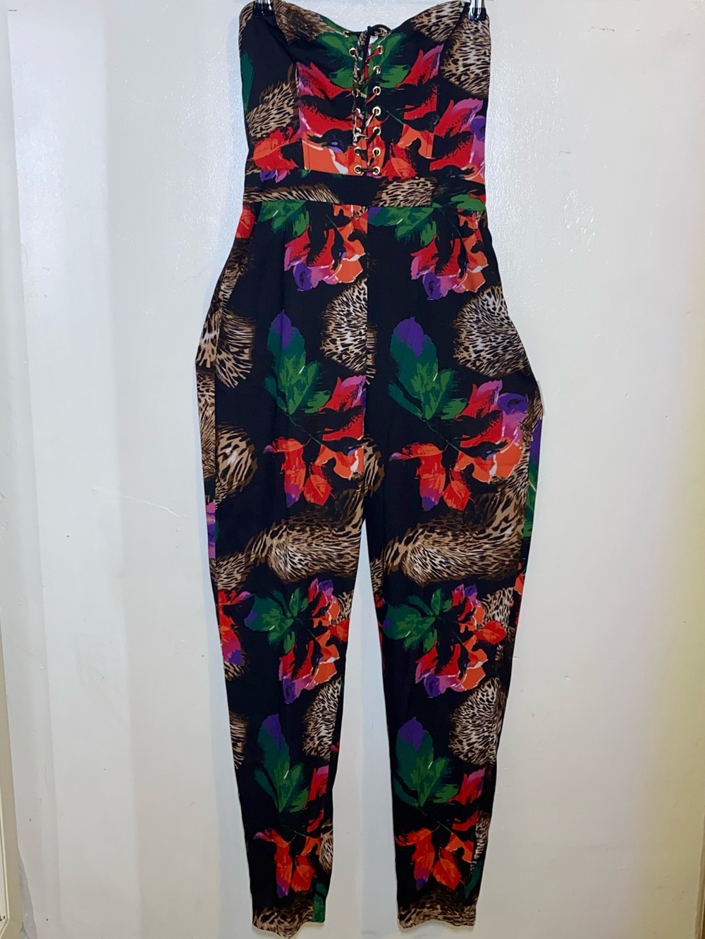 Bebe Black Floral Strapless Romper with open back Accent and Pockets Size Small